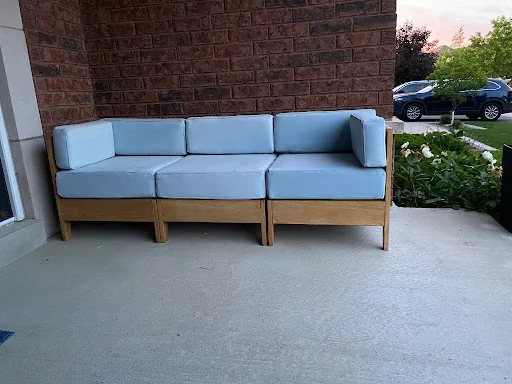 Modular oak sectional in three-seat sofa configuration