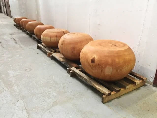 Palletized run of carved cedar pebble sculptures ready for transport to CIBC Flagship, Commerce Court