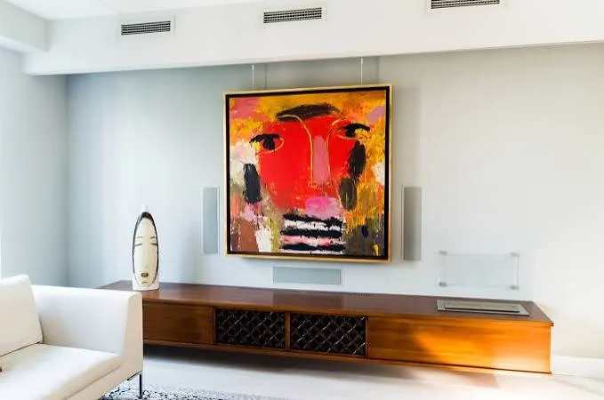 Floating oak stereo chest — the fireplace cavity above is filled with stone, with a glass panel mounted against the wall for fire safety, exactly as built.