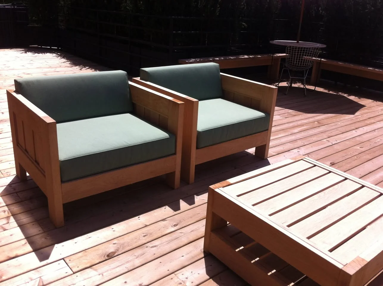 Oak patio chairs and table installed on the patio. East Room, Toronto