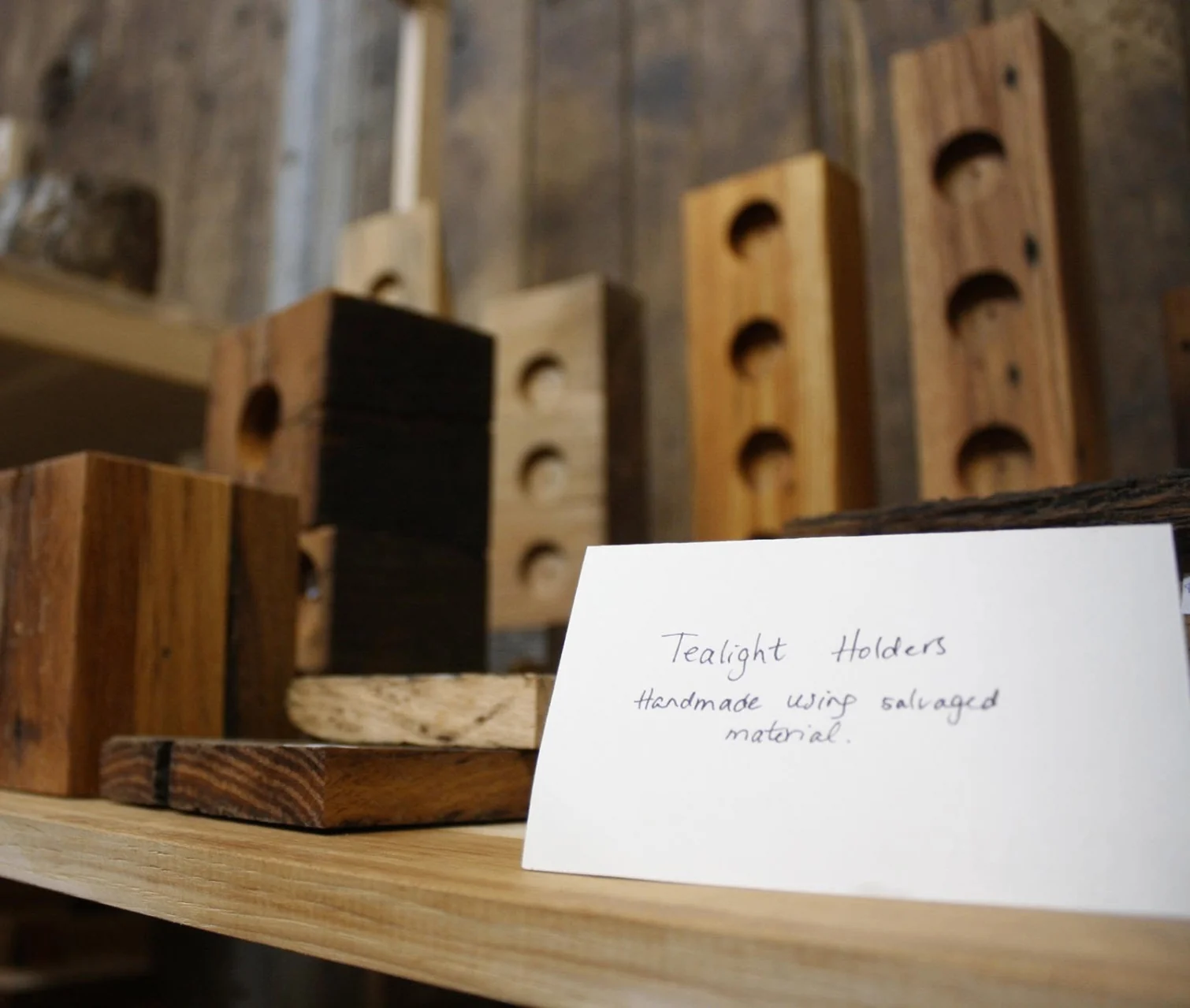 Salvaged timber tealight holders on display